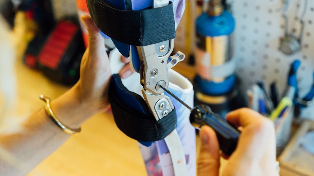 performing a repair on an orthoses with a screwdriver