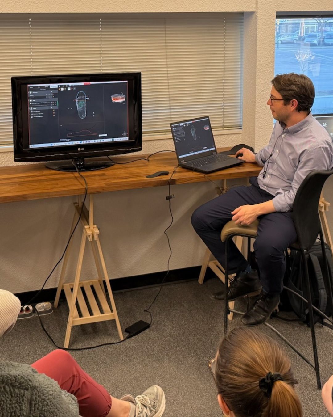 man presenting new technology to a group